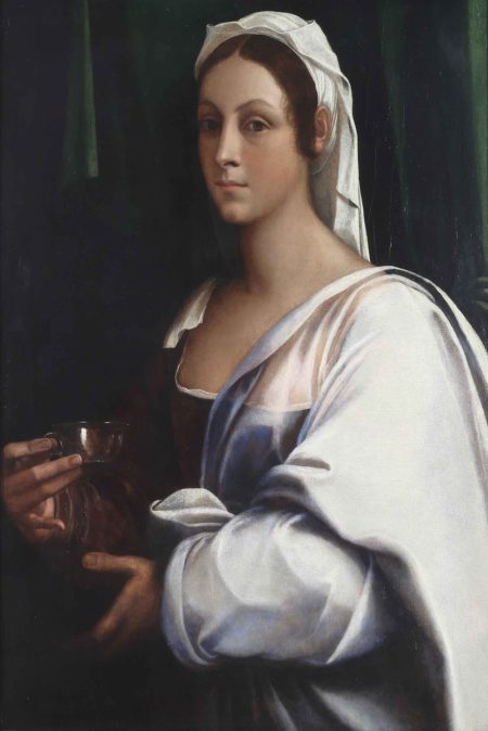 A half-length portrait of a lady with fair skin and brown hair, holding a silver cup. She wears a white head covering and drapery and stands in front of a dark green curtain.