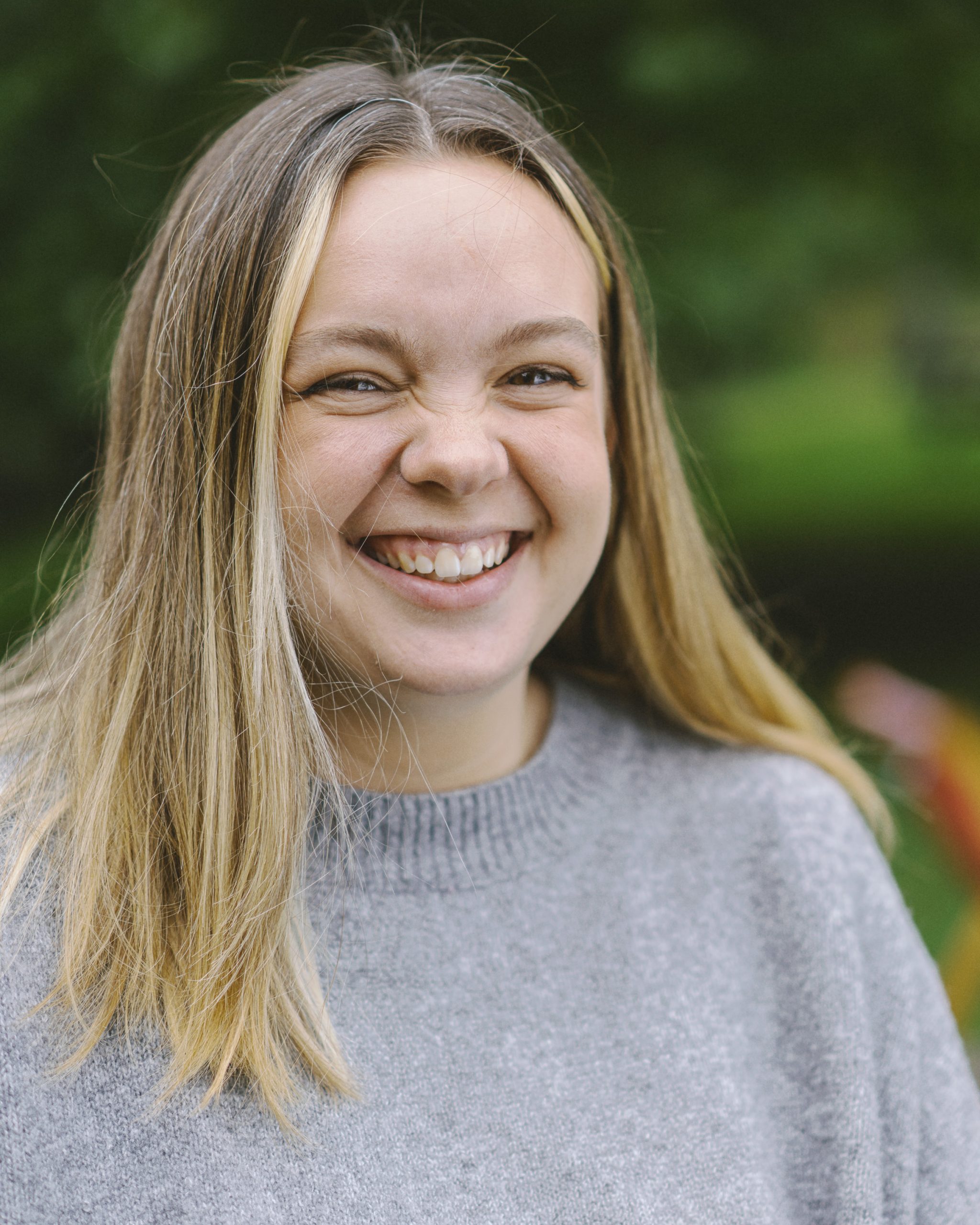 Young lady smiling with crinkly nose