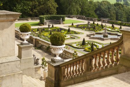 View of the Italian Parterre from the top of the Terrace steps. The parterre and sweeping flower borders feature a vibrant array of plants, including perennials, roses, climbing plants, and tender exotics, all carefully designed to complement the neo-classical architecture of Harewood House.