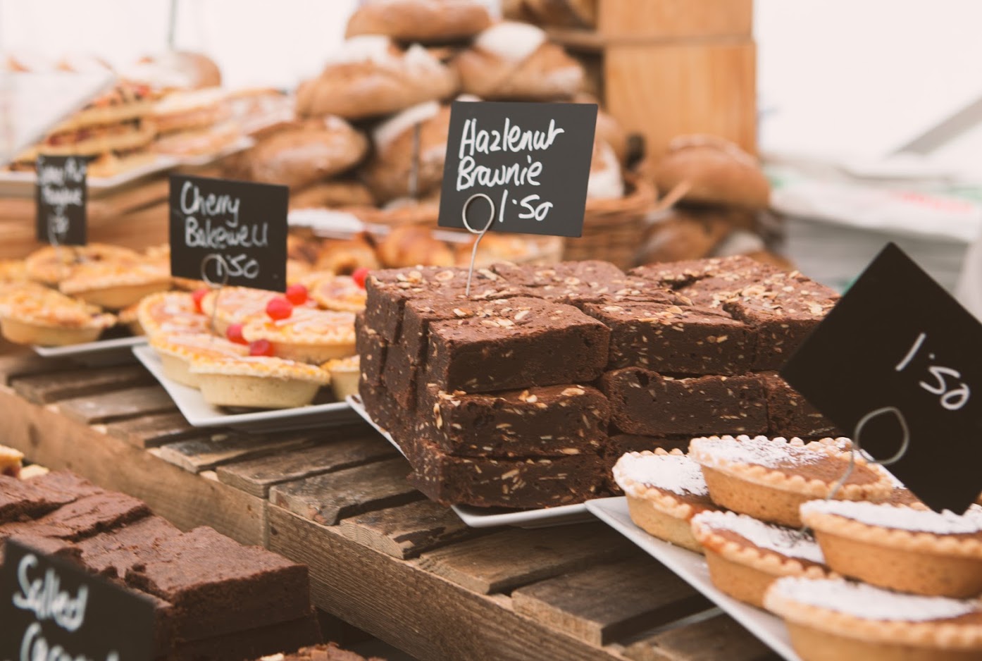 A table showcasing an assortment of delectable desserts, including cakes, brownies and tarts, invitingly arranged